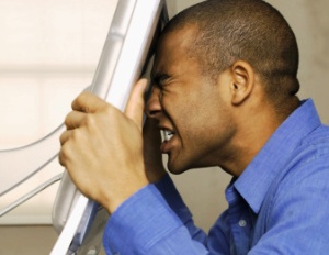 businessman-stressed-at-computer-300x232.jpg