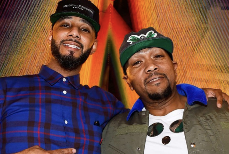 Verzuz creators Swizz Beatz and Timbaland give each other a side hug.